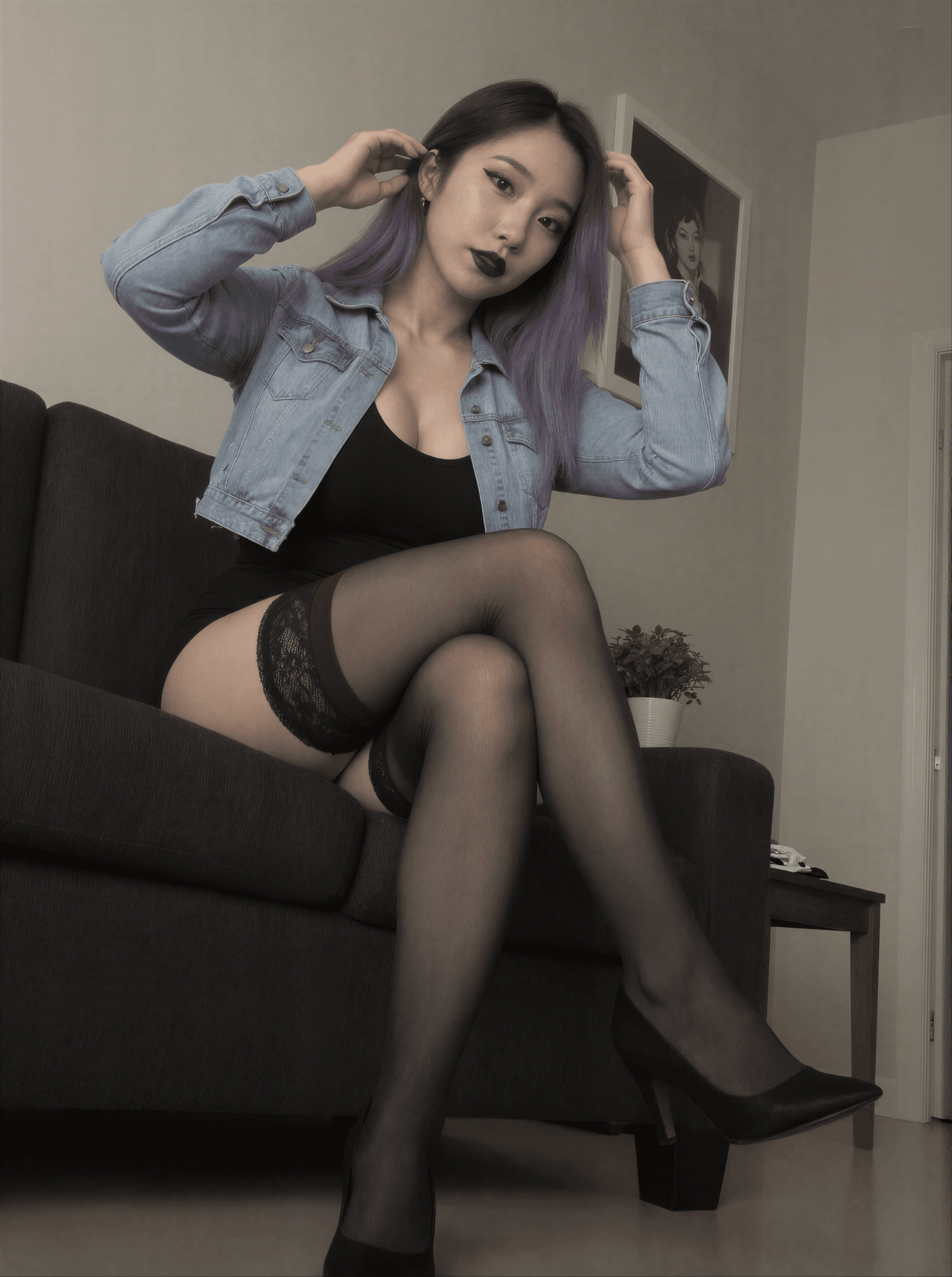 Sipping shadows on the couch, purple locks and lace whispering secrets. Who's ready to unravel the mystery? 💜🖤 #DonnaDark #GothGlam